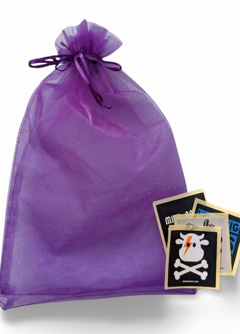 a purple bag filled with stickers and a bag of stickers