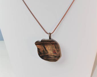 Walnut - Visions in Wood Hand Carved resembling  an Ocean Scene and a Red Sail boat on the Horizon on 20" Copper Chain