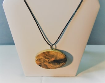 Necklace from Buckeye Wood - Visions in Wood Hand Carved resembling a Desert scene in Natural wood on 20" Black Satin Cord