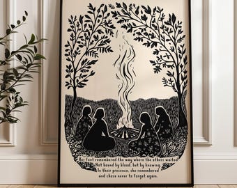 May include: Black and white framed art print depicting a gathering around a bonfire under a canopy of trees. The print features silhouettes of figures and the text: "Her feet remembered the way where the others waited..."