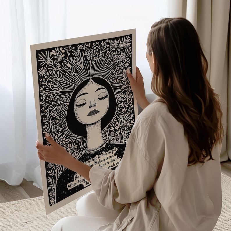 May include: Black and white illustration of a woman with closed eyes surrounded by flowers. The text "Be true when they are much, much smaller" is printed below the image.