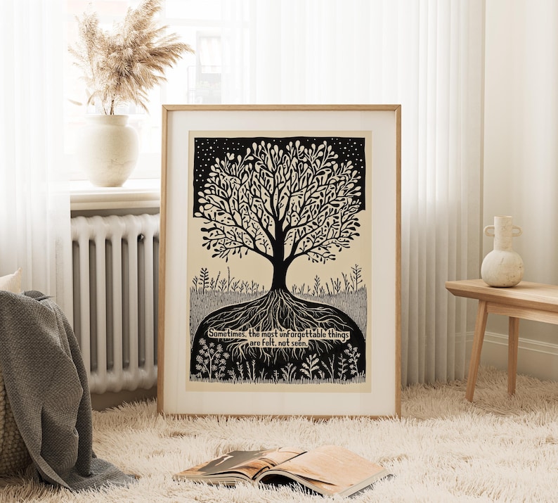 May include: A framed art print featuring a black and white tree illustration with intricate details. The tree's roots are visible, and the artwork includes the text: "Sometimes, the most unforgettable things are felt, not seen."