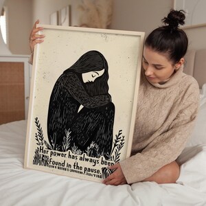 May include: Black and white illustration of a person sitting with their head down. The text reads "Her power has always been found in the pause."