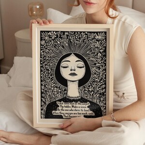 May include: Black and white illustration of a woman with her eyes closed, surrounded by flowers. The text reads: "Track some mud on the carpet. Flip tables. Make a scene. Be the one who dares to lead. When they say you are too much, smile. Then become..."