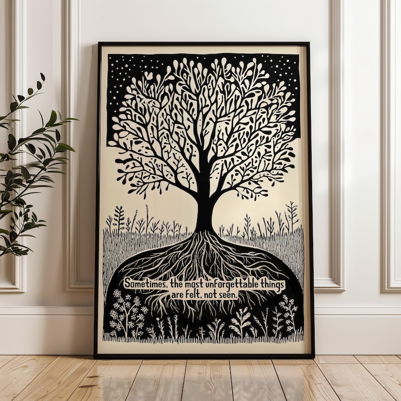 May include: Black and white framed art print featuring a tree with intricate branches and roots. The artwork includes the text: "Sometimes, the most unforgettable things are felt, not seen." The print is displayed on a light beige background.