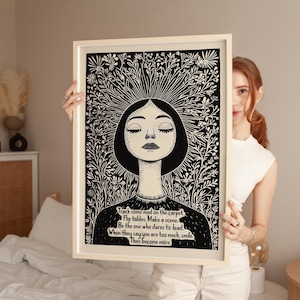 May include: Black and white illustration of a woman with closed eyes surrounded by flowers. The text reads: "Track some mud on the carpet. Flip tables. Make a scene. Be the one who dares to lead. When they say you are too much, smile. Then become more."