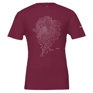 May include: A maroon t-shirt with a white topographical map design. The map is centered on the front. The shirt has short sleeves and a crew neck. The word "Jef" is printed on the right sleeve.