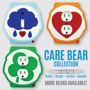 May include: Three decorative wall plates featuring Care Bear designs: a light blue rocker switch plate with a blue cloud, an orange outlet plate with a red heart, and a green outlet plate with a green clover. Text reads CARE BEAR COLLECTION.