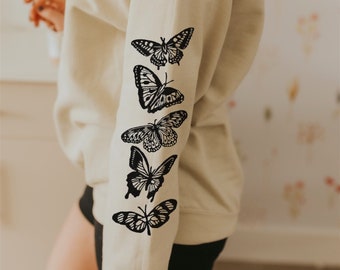 Coton ouaté papillons imprimés aux manches, crewneck unisexe avec imprimé insectes fait à la main, dessin linogravure, mode éthique