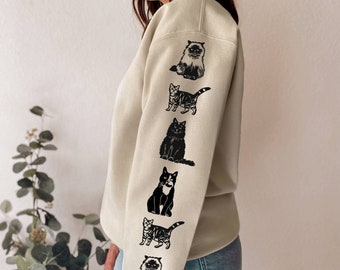 Coton ouaté motifs chats aux manches, crewneck unisexe avec imprimés chats fait à la main, chandail doux, dessin linogravure, mode éthique