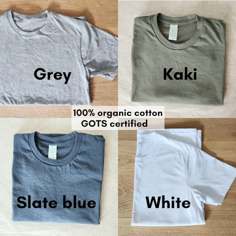 May include: Four folded t-shirts in different colors: grey, khaki, slate blue, and white. The shirts are made of 100% organic cotton and are GOTS certified.