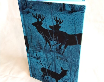 DEER silhouettes grace this journal's green lined pages