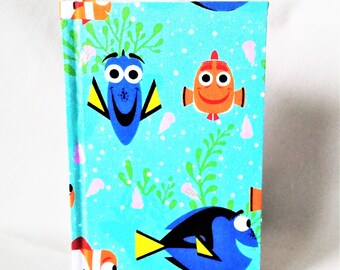 FINDING NEMO  journal: Rainbow colored blank pages inside, brightly colored NEMO characters on outside of this handbound book.