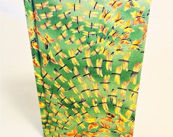 Butterflies, dragonflies flit on hard cover: green unlined pages inside.
