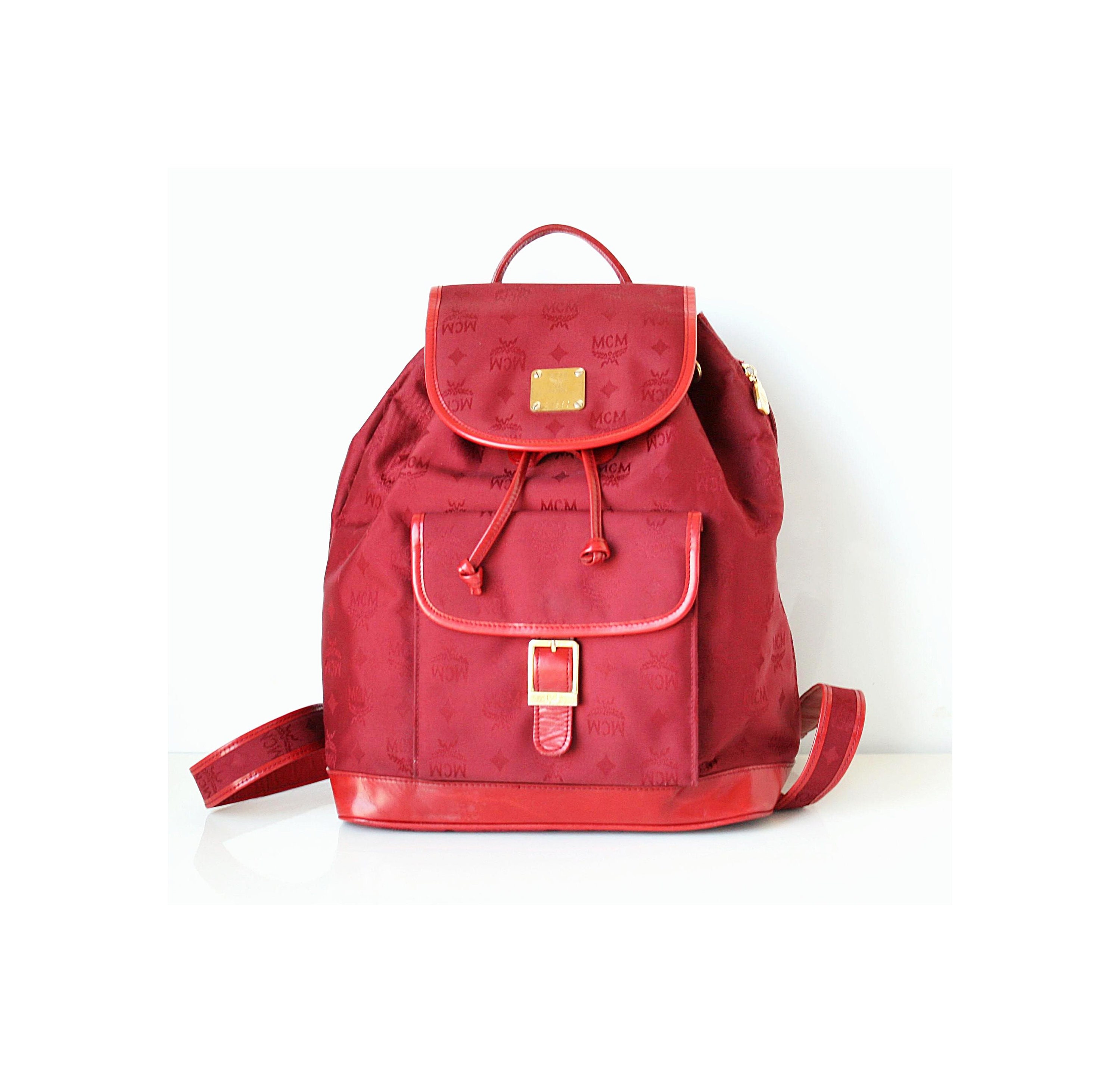 red mcm backpack