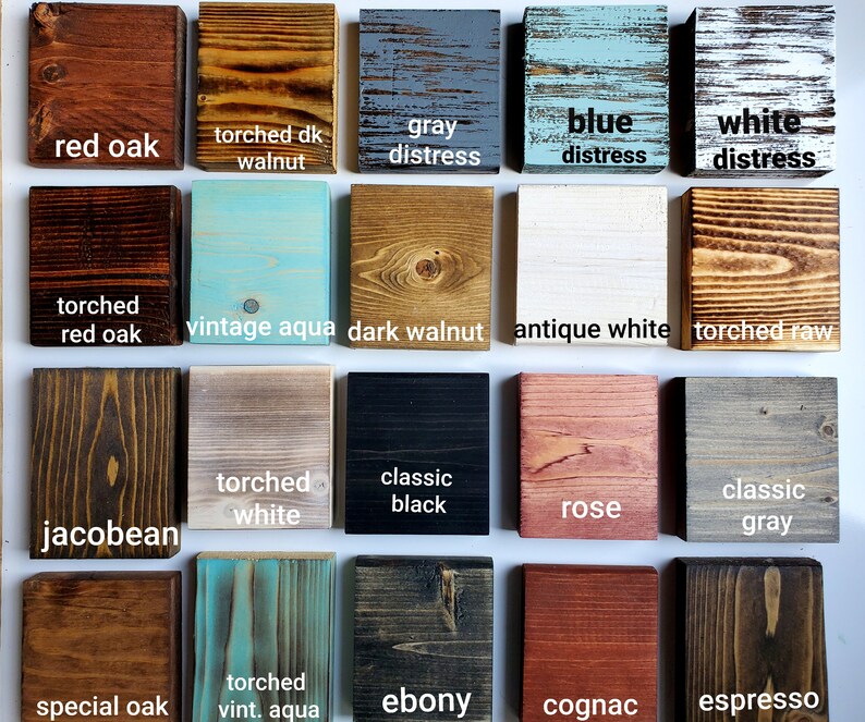 May include: A collection of 16 wood stain samples, showcasing various colors and finishes. The samples include red oak, torched walnut, gray distress, blue distress, white distress, torched red oak, vintage aqua, dark walnut, antique white, torched raw, jacobean, torched white, classic black, rose, classic gray, special oak, torched vint. aqua, ebony, cognac, and espresso.