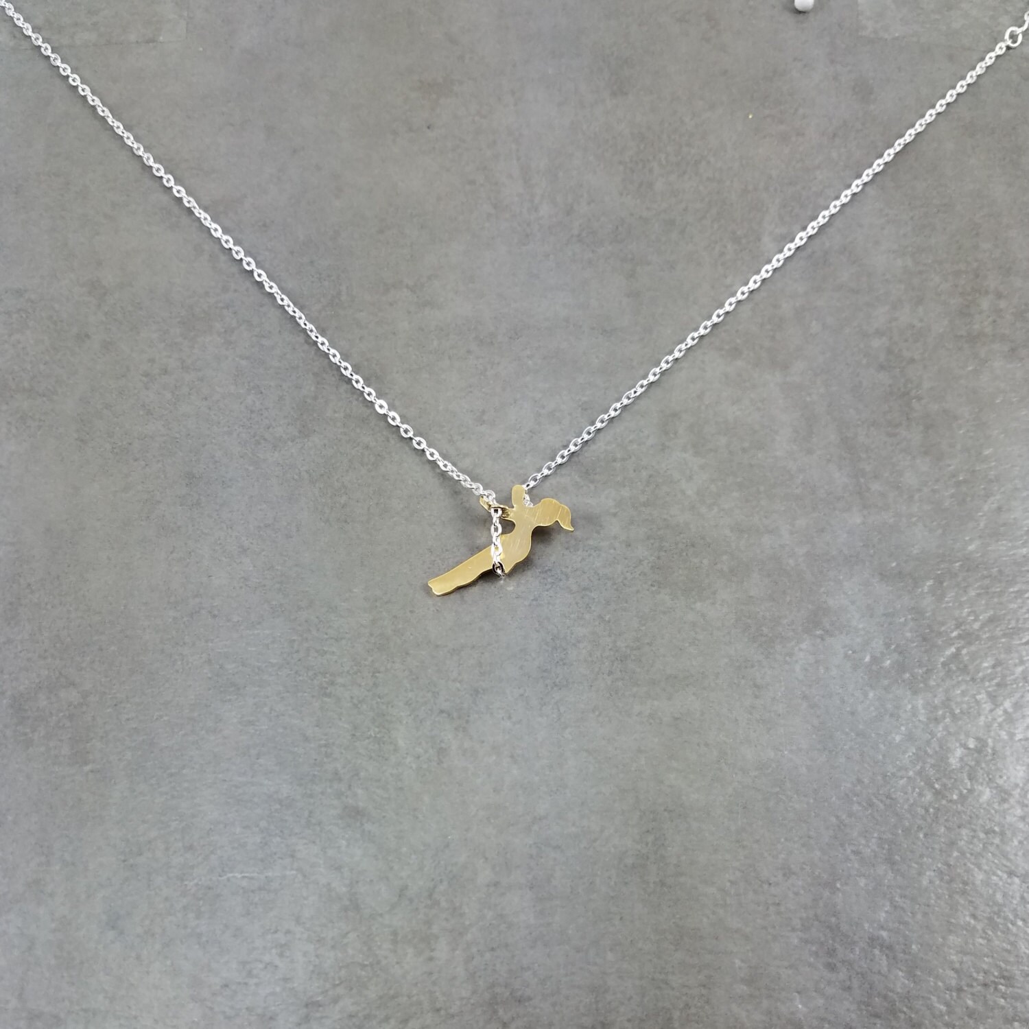 Girl on a swing best sale necklace