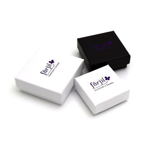May include: Three small square boxes, two white and one black, with the logo "f&aring;rjil Handmade in Sweden" printed on them.