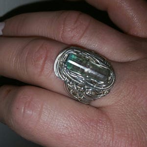 gorgeous terminated teal capped paprook pink tourmaline crystal set in sterling silver wire wrapped  ring sz6