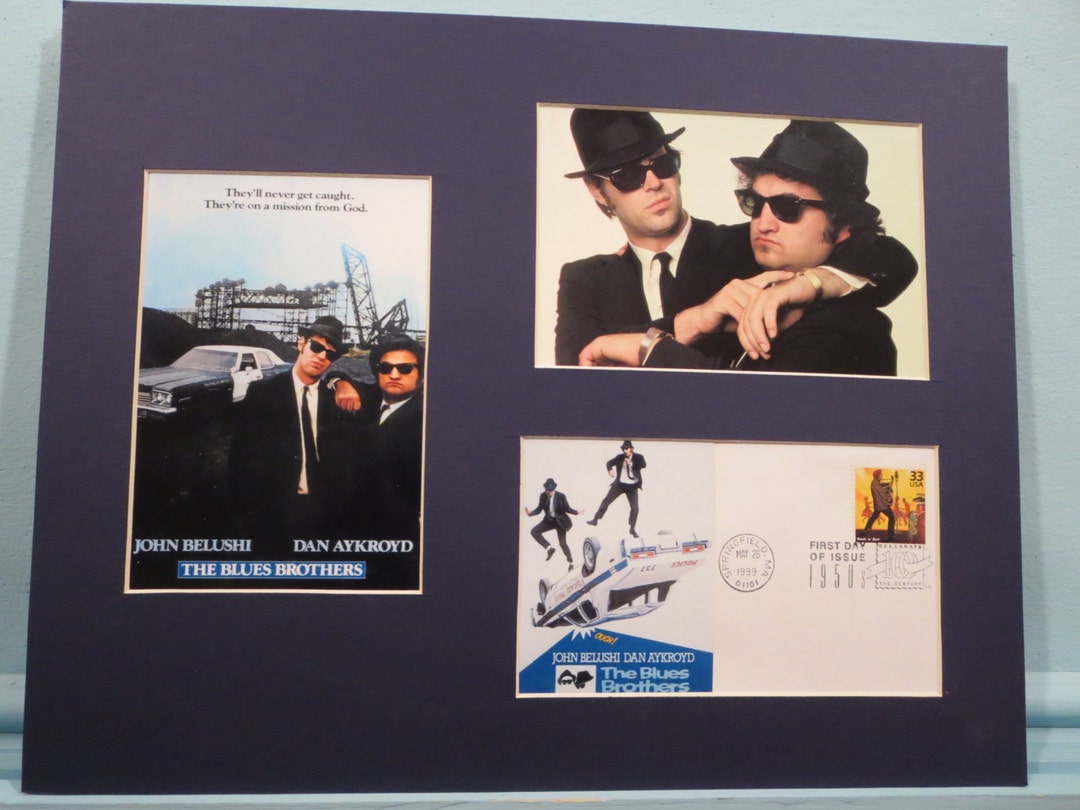 Dan Aykroyd and John Belushi as the Blues Brothers and the First
