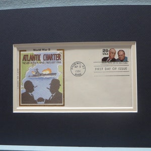 May include: A first day of issue envelope for a stamp commemorating the Atlantic Charter, signed by President Franklin D. Roosevelt and Prime Minister Winston Churchill in August 1941. The envelope is cream coloured with a 29 cent stamp featuring the two leaders. The stamp is cancelled with a postmark from Phoenix, Arizona, dated September 3, 1991. The envelope also features a smaller stamp depicting a ship and the two leaders shaking hands.