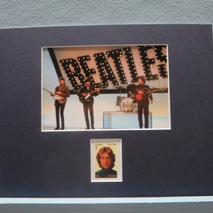 The Beatles in concert and the John Lennon of the Beatles  stamp