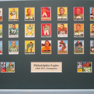 May include: A framed collection of 1960 Philadelphia Eagles football cards. The cards are arranged in a grid with a title at the bottom that reads "Philadelphia Eagles 1960 NFL Champions".