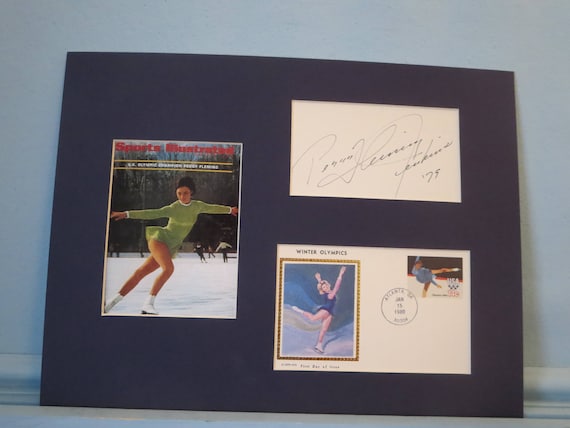 Peggy Fleming wins the1968 Olympic Gold Medal for figure skating as well as  the Olympic Figure Skating First Day Cover her autograph