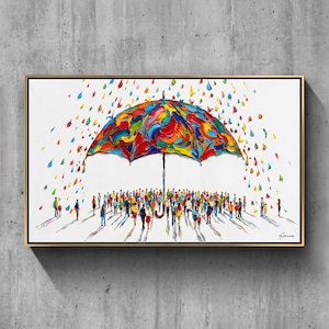 May include: A framed painting featuring a large, multi-colored umbrella with thick, textured paint strokes. Beneath the umbrella, a crowd of small, colorful figures stands on a white background, surrounded by falling, vibrant paint droplets.