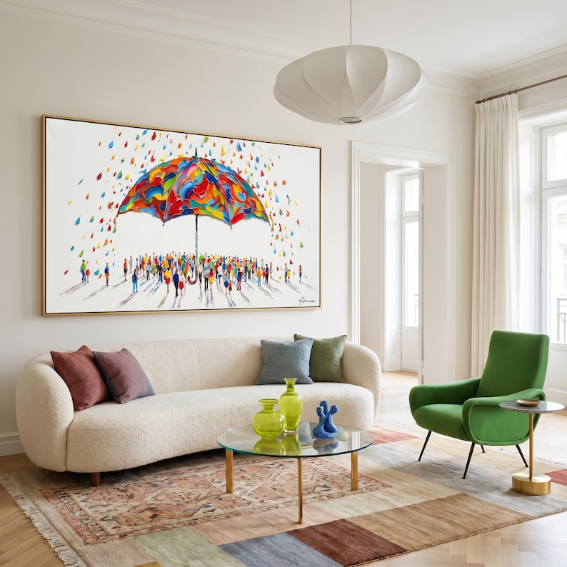 May include: A large rectangular wall art piece featuring a vibrant, multi-colored umbrella sheltering a crowd of small, abstract figures. The scene is set against a white background with colorful, scattered raindrops falling around the umbrella.