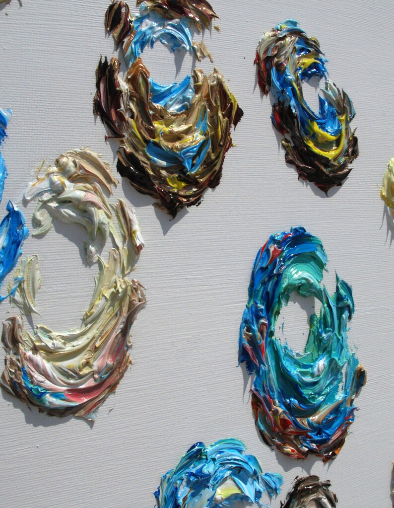 May include: Abstract painting with swirling, textured circles in shades of blue, brown, yellow, white, and red on a white canvas.