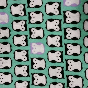 A soft snuggly teal flannel pillowcase with owls