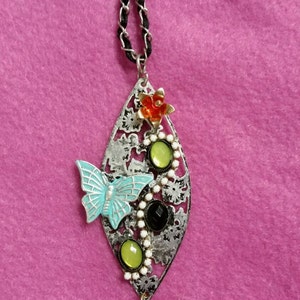 Beautiful silver necklace with colored beads and a metal butterfly on a 16" chain