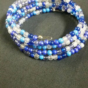 A shades of blue and purple beaded wrap bracelet