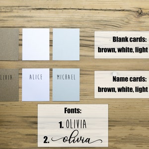 May include: A set of blank cards in brown, white, and light grey. The cards are labeled "Blank cards" and "Name cards". The image also shows two different fonts for the name "Olivia".