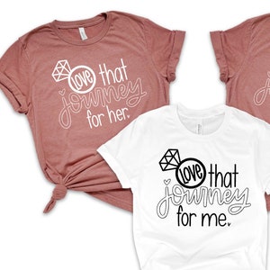 May include: Three t-shirts with the text "Love that Journey" and a diamond ring graphic. One shirt says "for her" and the other two say "for me".