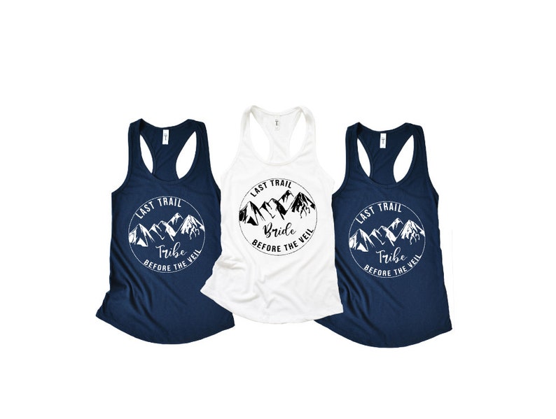 May include: Three tank tops with a mountain range graphic and the text "Last Trail" and either "Bride" or "Tribe" with the words "Before the Veil".