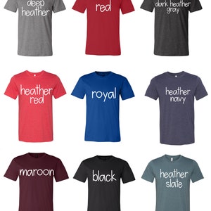 May include: Nine t-shirts in different colors and styles. The colors include deep heather, red, dark heather gray, heather red, royal blue, heather navy, maroon, black, and heather slate. Each shirt has a different color and a white text label on the front.