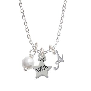 May include: A silver necklace with a pearl, a star charm that says "wish", and a cursive letter "A" charm.