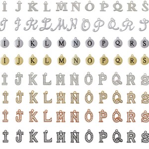 May include: A chart showing different styles of letter charms in various finishes, including silver plated, gold tone, rose gold tone, and black nickel. The styles include capital, gelato, pebble disc, and crystal initial.