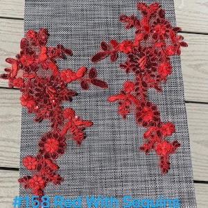 May include: Red lace applique with sequins, measuring 13 inches long by 8 inches wide. #158 Red With Sequins.