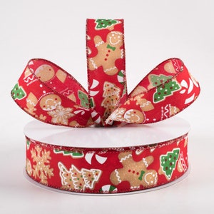 May include: Red and white ribbon with a gingerbread man, candy cane, and Christmas tree print. The ribbon is 2.5 inches wide.