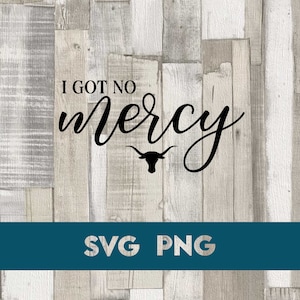 May include: A woodgrain background with the text "I got no mercy" in black cursive font. A black silhouette of a longhorn bull's head is below the text. The text "SVG PNG" is in white text on a teal blue background at the bottom of the image.