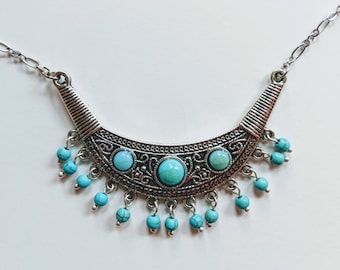 Egyptian Style metal necklace with blue stone beads.