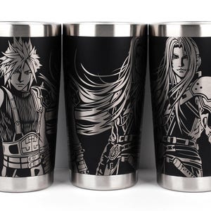 May include: Three black stainless steel travel mugs with silver character illustrations. Each mug features a different character design from a video game. The mugs have a silver rim and base.