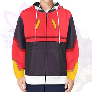 May include: A red, black, and yellow zip-up hoodie with a white drawstring hood. The jacket has a colour-block design with yellow accents on the sleeves and two yellow rectangles on the chest. The zip is white.