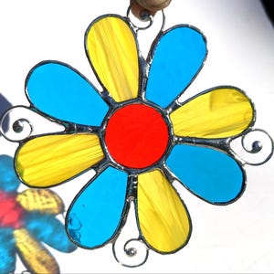 Groovy Wispy Yellow and Turquoise Daisy Flower with Red-Orange Center Stained Glass Suncatcher