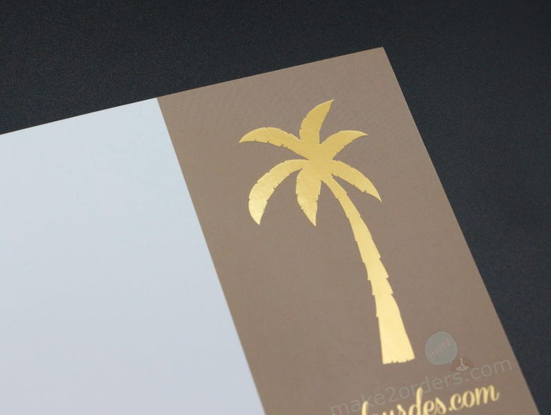 May include: A gold foil palm tree design on a tan card, with a white section on the left. The card is angled against a dark background. The website address "make2orders.com" is printed in gold at the bottom.