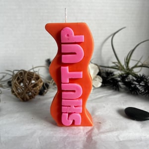 Shut up! Kindly tell your friends and family to SHUT UP! Enjoy a hand-poured candle available in various colors.