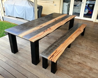 Hardwood timber and concrete dining table with powder coated steel 4 post base.  2.7m polished concrete dining or outdoor patio furniture.